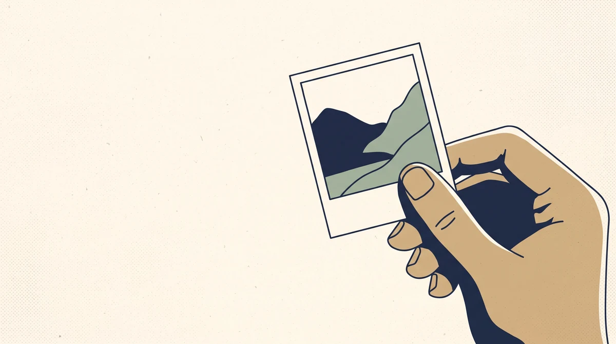 A small printed photograph held between a finger and thumb, showing how small it really is.