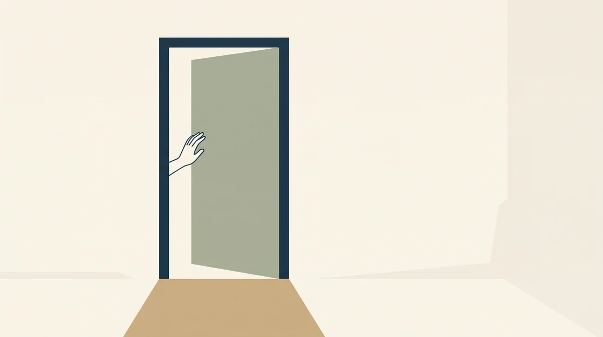 An open doorway with a threshold strip and a hand resting on the frame